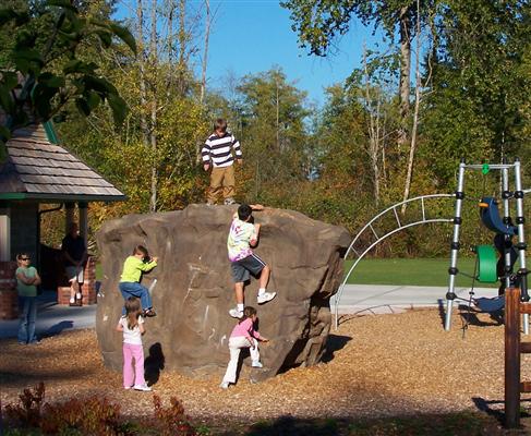 Children climbing the rock wall at Cougar Park