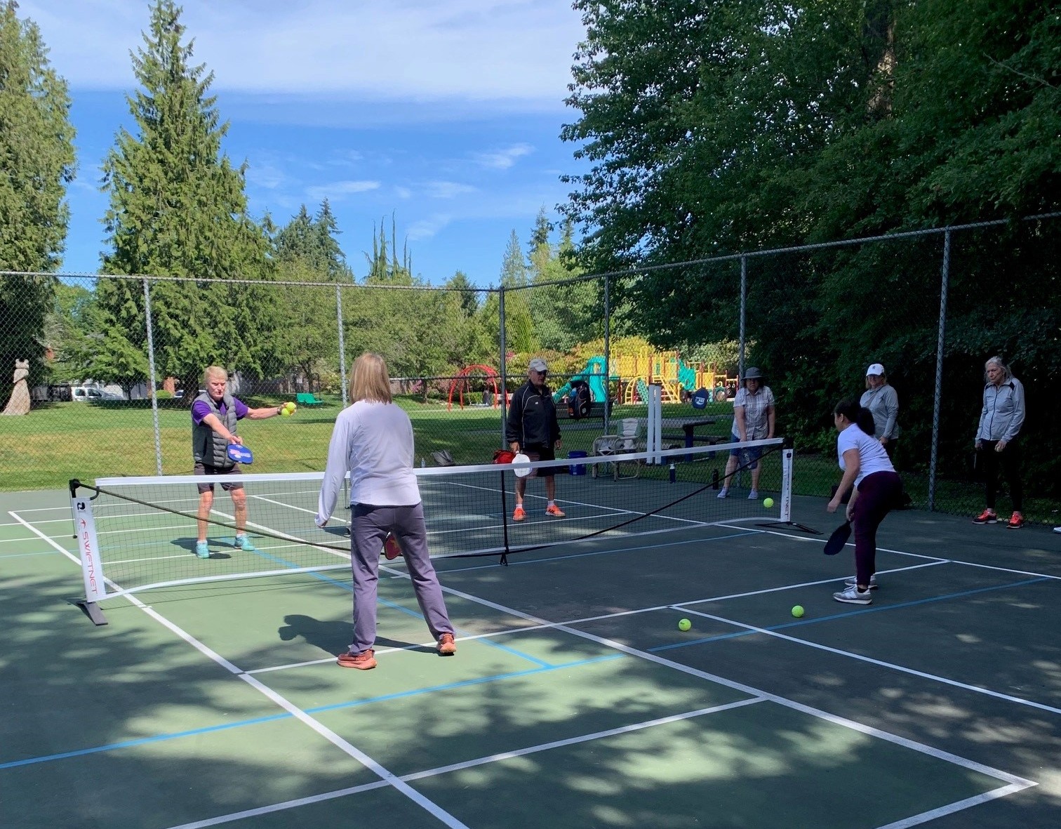 People playing pickleball