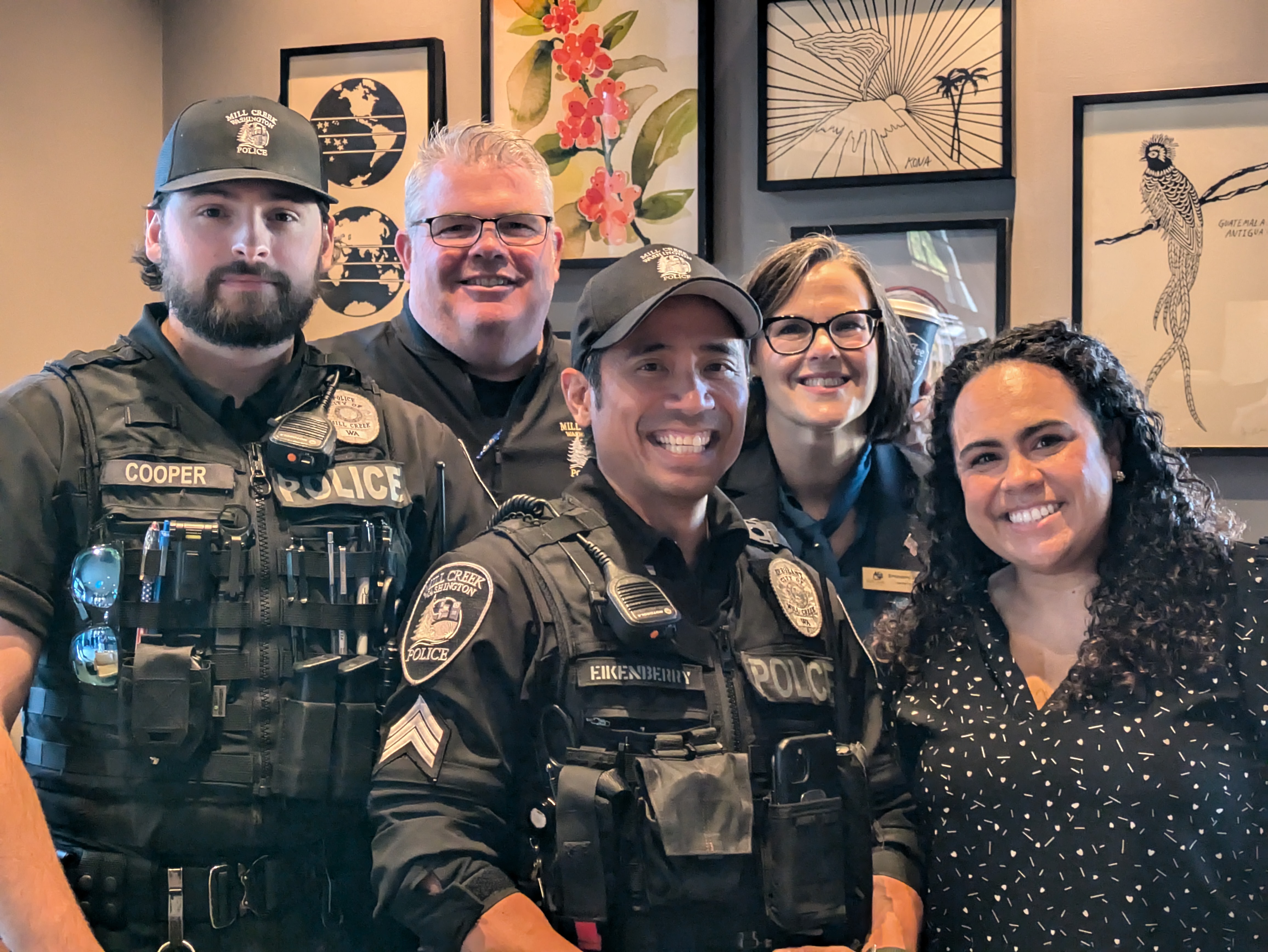 Police officers and community leaders at Coffee with a Cop.