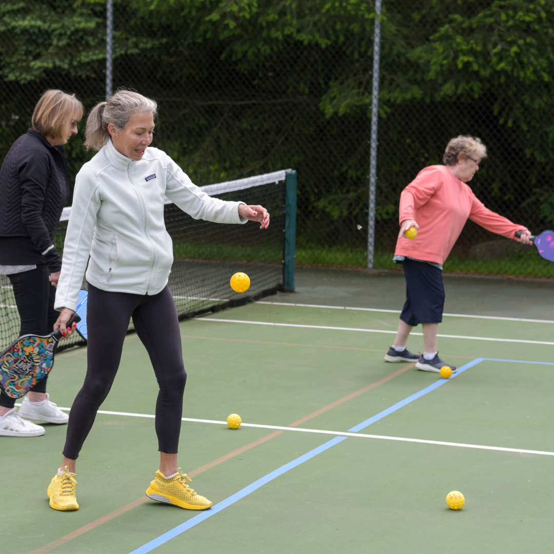 City of Mill Creek Pickleball classes with players practicing on the court.